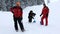 Red Cross rescuers with shovels