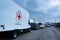 A red cross truck car transporting humanitarian aid