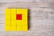 Red cube block different from crowd of yellow blocks. Unique Leader, strategy, independence, think different, business and success