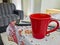 Red cup of coffee on grandmas table. Angra dos Reis