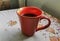 Red cup of coffee on grandmas table. Angra dos Reis
