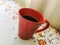 Red cup of coffee on grandmas table. Angra dos Reis
