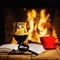 Red cup of coffee or tea, candle in lamp, magnifier glass and old book on wooden table near fireplace.