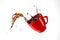 Red cup mug with coffee splash