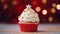 a red cupcake in front of a starry backdrop from the christmas lights