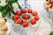 Red cupcakes in a shape of heart on banquet table.