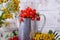 Red currant berries in a metallic jug