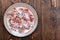 Red currant, gooseberry in sugar on a plate