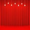 Red curtain with glowing light bulbs and glossy floor