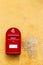 Red danish letterbox on a yellow wall