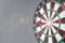Red dart hitting a target on center of Bullseye or Dartboard. Business, competition, goal, success and marketing concept