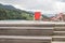 Red deckchair at the edge of an outdoor hydromassage pool, Italy