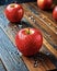 Red delicious apples with water droplets on beautiful wooden table