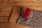 Red delicious candies in the glass jar on the wooden surface