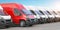 Red delivery van in a row of white vans. Best express delivery and shipemt service concept