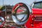 Red detail on the headlight of a vintage car