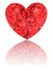 Red diamond in shape of heart on glossy white