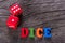 Red dice word on a wooden table