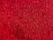 Red disco fabric texture - hairy eyelash fringe fabric background. Festive, carnival or fashion background concept. Luxury textile