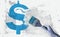 Red dollar sign and brush in hand on grundge white grey background. Currency money financial concept