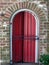 Red Door behind Iron Gate