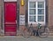 Red door and bicycle