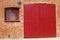 Red door in brick wall. Dell Quay. UK