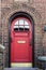 Red door of a house in Brooklyn in New York City, USA