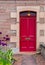 Red door in old house in Scotland