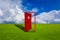 Red door placed on an outdoor lawn with blue sky floor.