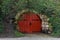 Red door set into hillside