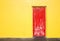 Red door on yellow wall