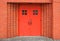 Red doors brick wall