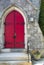 Red doorway, flowers in pot, church, downtown Keene, New Hampshi