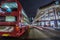 Red double-decker bus. Pedestrian and traffic in Oxford Circus at night