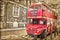 Red double decker bus, vintage sepia texture, London