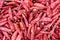 Red dried chili pepper heap close-up