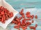 Red dried goji berries. Goji berries on wooden background.