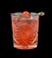 Red drink with a maraschino cherry isolated on black