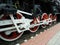 Red driving wheels of a steam locomotive, connected by levers