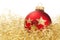 Red dull christmas ball in golden glitter cotton