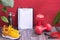 Red dumbbells and yellow sneakers, water bottle and jump rope, note board and measurement tape