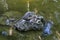 Red-eared slider or red-eared terrapin in stone surrounded by water looking at camera.