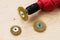 Red electric drill and three round metal wire brushes for cleaning of metal and wood and remove rust over rough wooden surface.