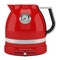 Red electric kettle isolated on white