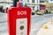 Red emergency police SOS call button alarm box with light bar, cctv camera and speaker device for urgent comunication on