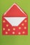Red envelope on green background, christmastime