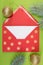 Red envelope on green background, christmastime