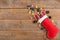 Red Epiphany Befana's stocking with sweet coal and candy on rustic wooden background, Italian Epiphany day tradition