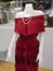 Red evening dress on female display mannequin